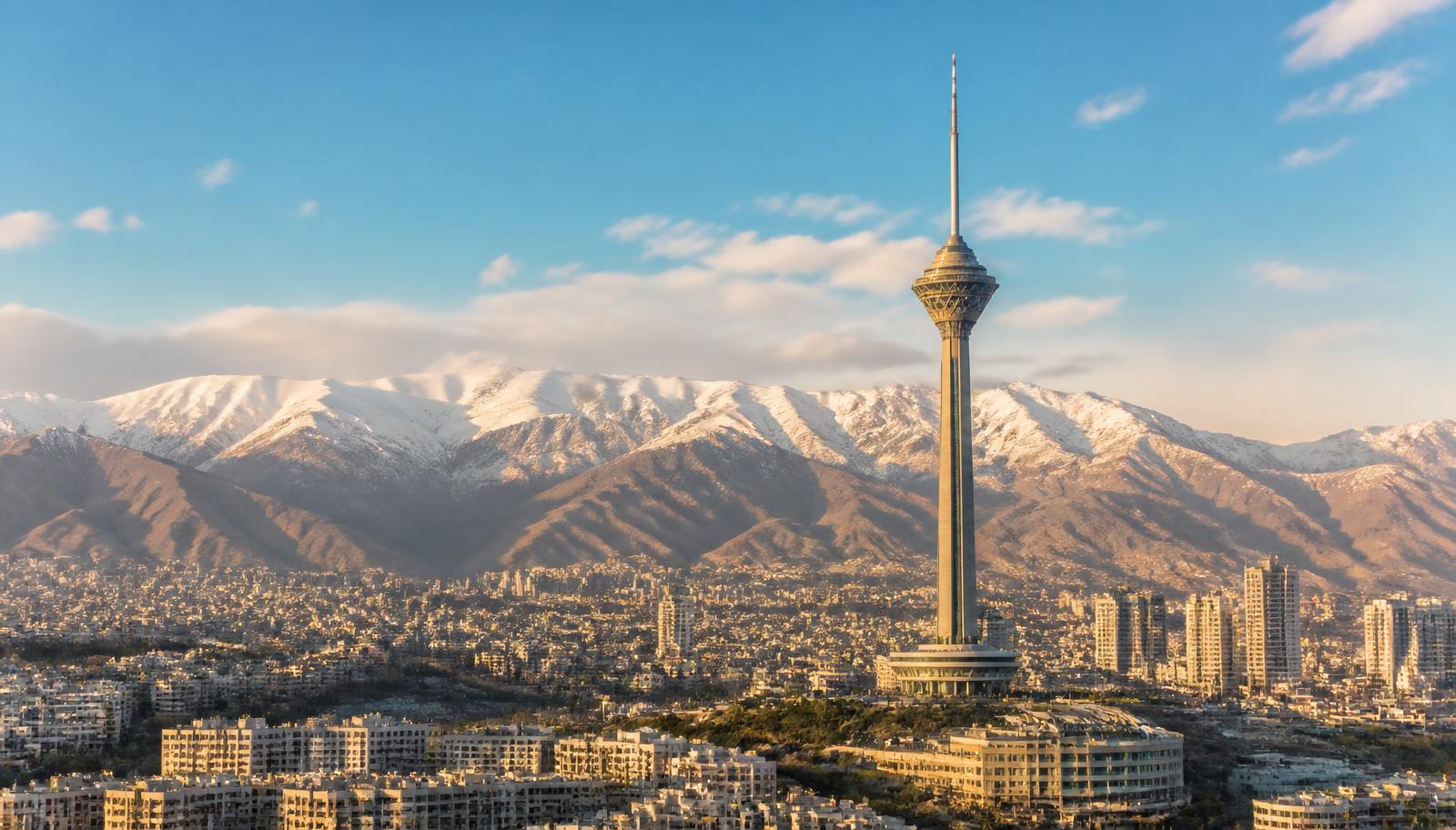 Tehran skyline with Milad Tower and the snowy Alborz mountains
